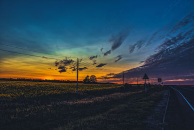 Scenic view of land against sky during sunset