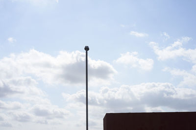 Low angle view of street light against sky