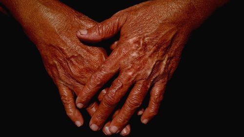 Close-up of old wrinkled hands