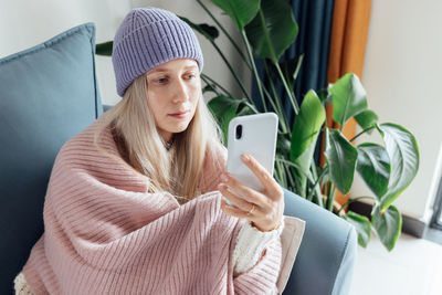 Young woman using mobile phone
