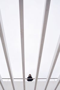 Low angle view of woman in a modern building