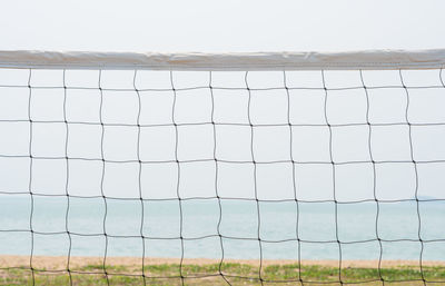 Fence on field against sky