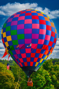 Low angle view of hot air balloons against sky
