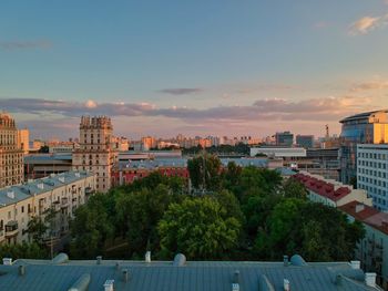 High angle view of buildings against cloudy sky