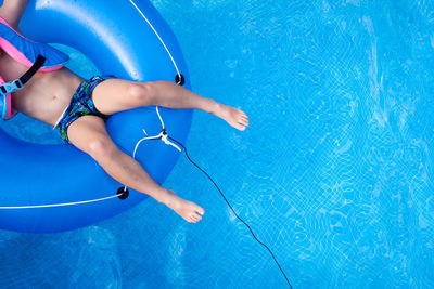 Low section of woman in swimming pool