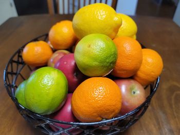 High angle view of fruits in basket on table