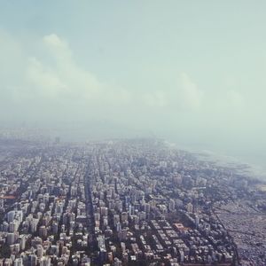 Aerial view of cityscape against sky