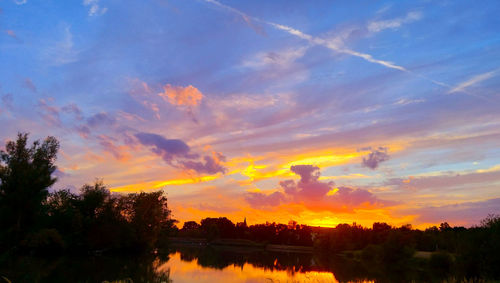 Scenic view of silhouette trees against sky during sunset