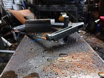 Close-up of wet metal in workshop