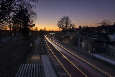 View of railroad tracks at sunset