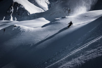 High angle view of person 
skiing on snowcapped mountain