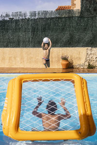 Children playing  in the pool