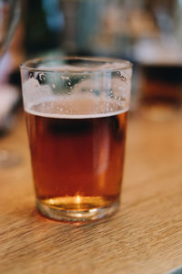 Close-up of beer in glass on table