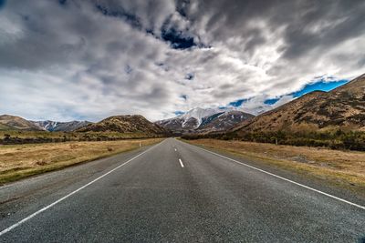 Road amidst landscape against sky