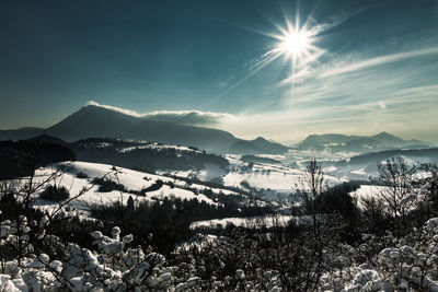 Scenic view of mountains against sky during winter