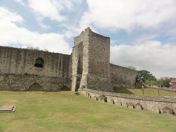 Historic building against cloudy sky