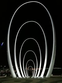 View of illuminated city against sky at night