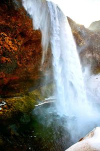 Close-up of waterfall against sky
