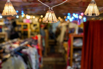 Lamps on the ceiling in the store on blurred background