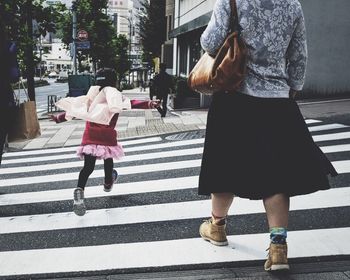 Full length of woman standing in city