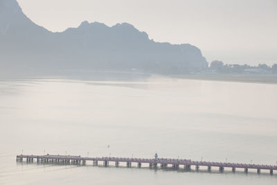 Pier over sea against sky