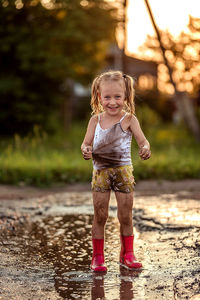 Portrait of cute girl standing outdoors