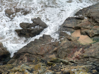 High angle view of rocks in sea