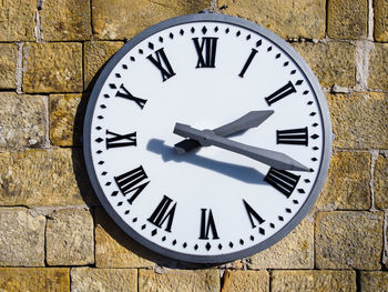 Close-up of clock on wall