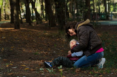 Father and son in forest
