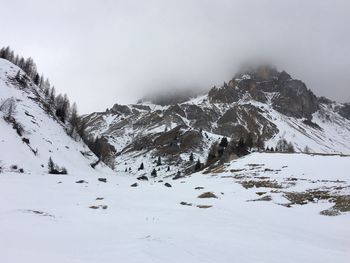 Scenic view of mountains against sky during winter