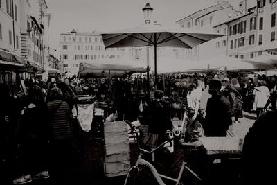 People at town square against sky