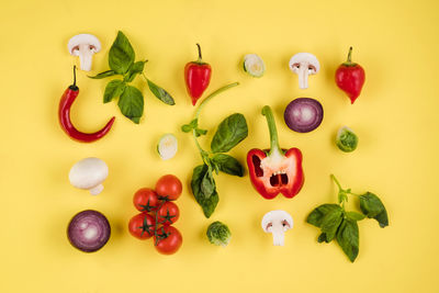 High angle view of fruits against yellow background