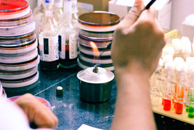 Close-up of person hands experimenting in laboratory