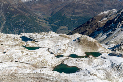 High angle view of rocks on mountain during winter