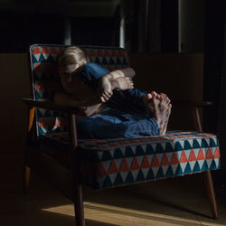 Man sitting on seat at home