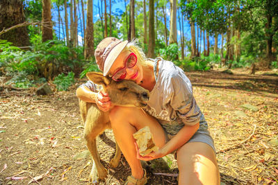 Midsection of a woman with dog