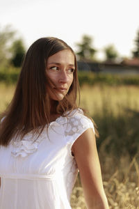 Beautiful woman standing on field