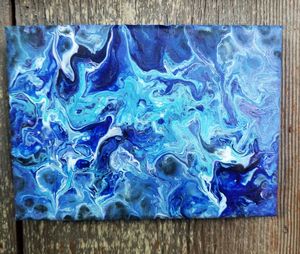 Directly above shot of multi colored water on wood