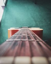 Close-up of guitar on table