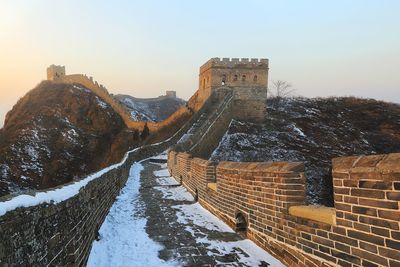 Panoramic view of snow covered mountain against sky