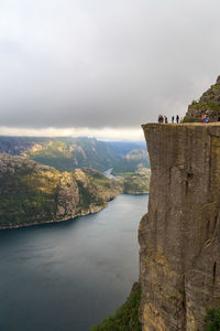 Low angle view of people walking on mountain