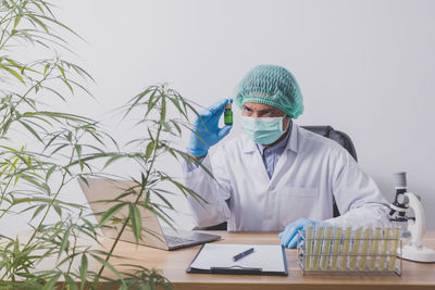 Female doctor examining patient in laboratory