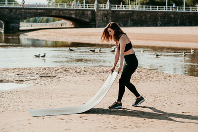 Full length of woman on beach