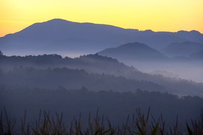 Scenic view of mountains against sky during sunset