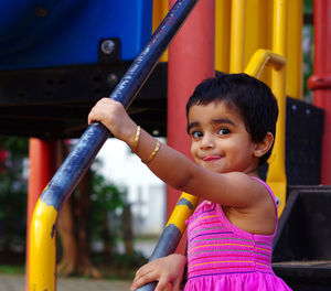 Portrait of cute boy playing at playground