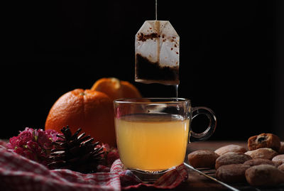 Close-up of orange juice on table
