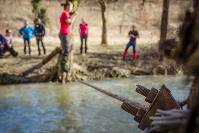 People on water against blurred background