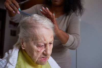 Close-up of senior woman with eyes closed