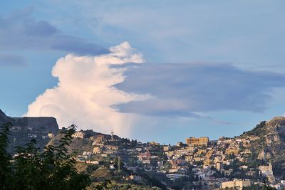 Buildings in city against sky