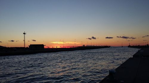 Scenic view of beach against sky during sunset